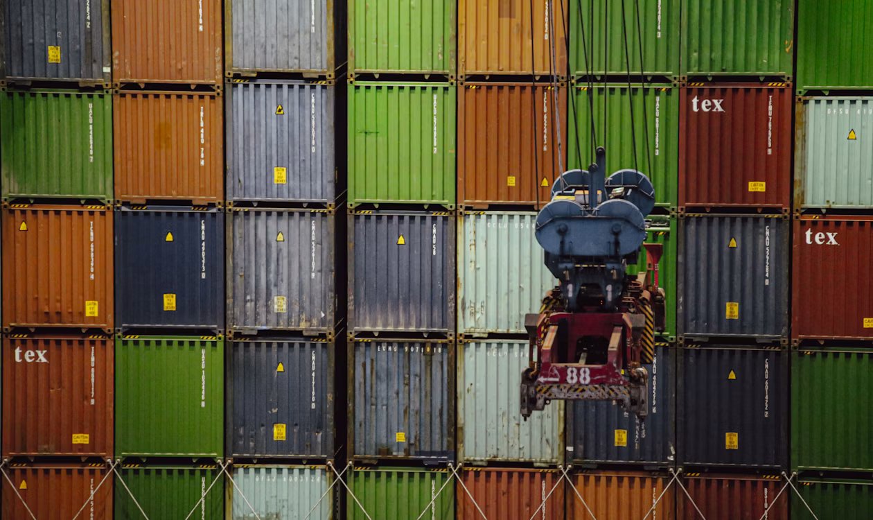 Shipping containers stacked at cargo terminal